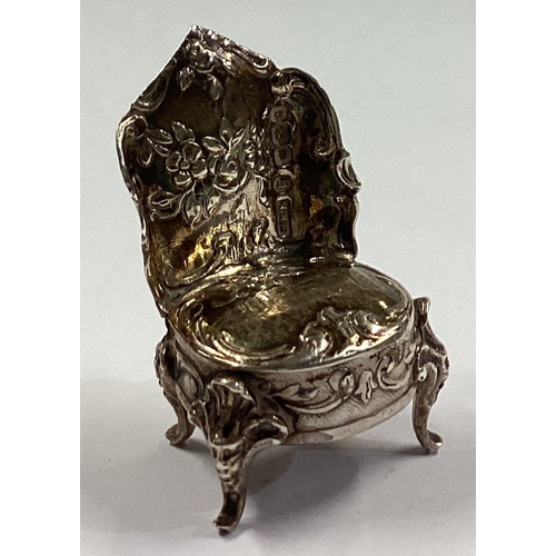 171 - A chased Victorian silver toy chair bearing import marks. Sheffield 1899. By SBL. Approx. 13 grams. ... 