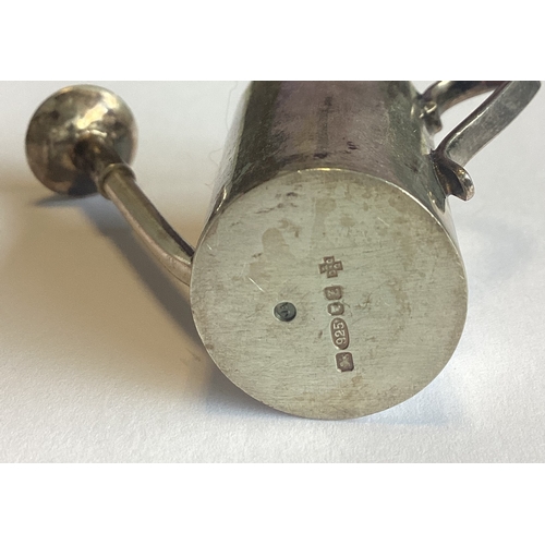 568 - A rare silver toy model of a watering can. Approx. 29 grams. Est. £40 - £60.