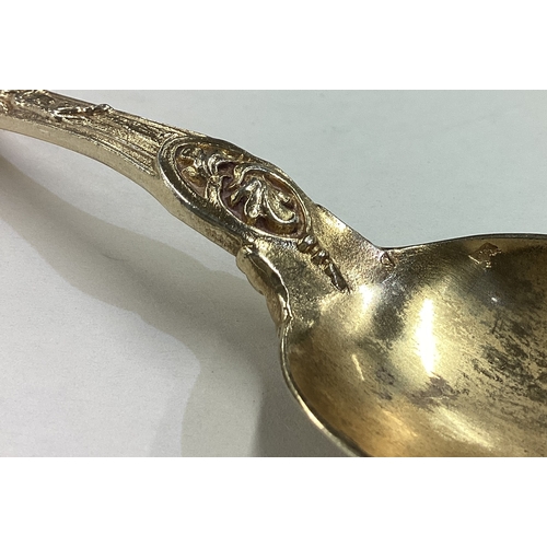 500 - A Victorian silver gilt Bacchanalian pattern christening knife, fork and spoon set. Approx. 182 gram... 