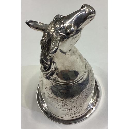 668 - CHESTER: OF HUNTING INTEREST: A silver horse head stirrup cup engraved with horse riding and dog hun... 