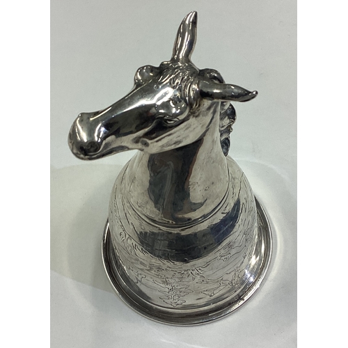 668 - CHESTER: OF HUNTING INTEREST: A silver horse head stirrup cup engraved with horse riding and dog hun... 