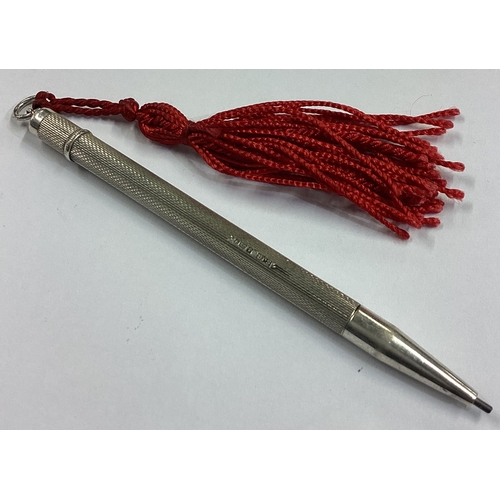 107 - An engine turned silver pencil. Birmingham. Approx. 12 grams. Est. £20 - £30.