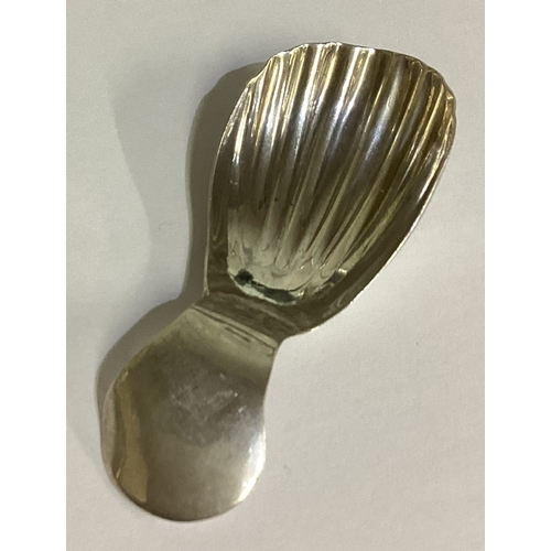 111 - A silver caddy spoon with fluted bowl. London 1945. By Kenneth Kirkpatrick Drury. Approx. 12 grams. ... 