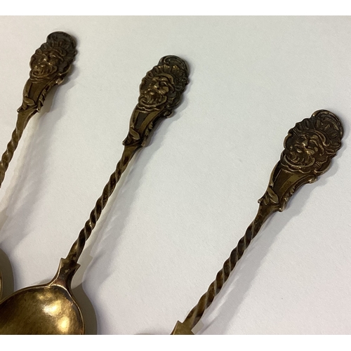 121 - A set of six Victorian silver gilt spoons embossed with figural decoration. 1868. Approx. 108 grams.... 