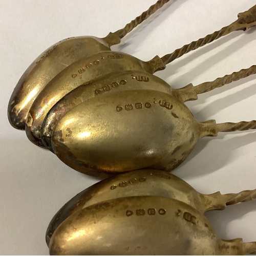 121 - A set of six Victorian silver gilt spoons embossed with figural decoration. 1868. Approx. 108 grams.... 