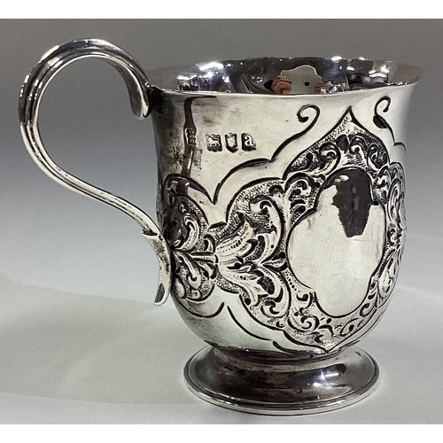 128 - A good chased silver christening mug. London. Approx. 85 grams. Est. £50 - £80.