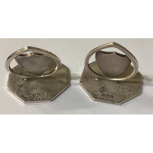 130 - A pair of silver menu holders bearing dog crests. Birmingham 1909. Approx. 47 grams. Est. £100 - £15... 