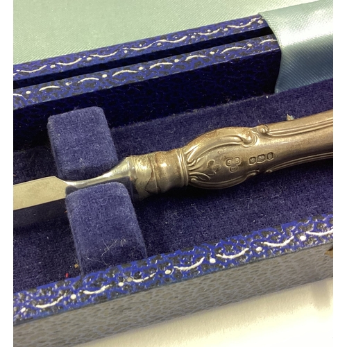 135 - A cased silver handled letter opener. Sheffield 1945. Est. £20 - £30.