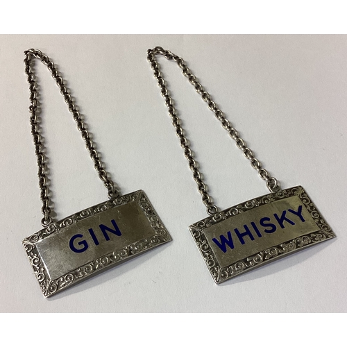 139 - A pair of silver and enamelled decanter wine labels for 'Gin' and 'Whisky'. Birmingham 1954. By T&S.... 