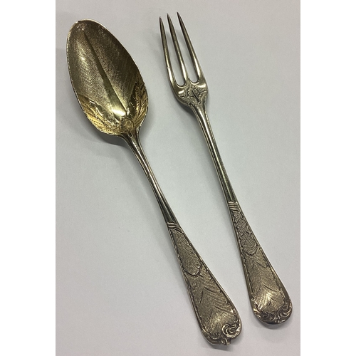 141 - A good quality two-piece silver gilt christening set with floral decoration. London. Approx. 66 gram... 