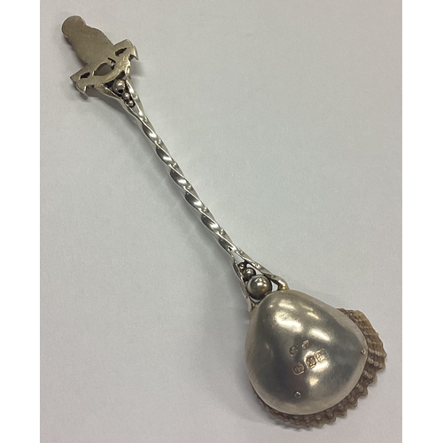 142 - A good quality silver parcel-gilt preserve spoon with shell bowl cast with bird to terminal. Birming... 