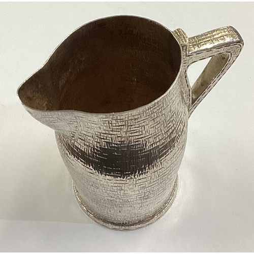 151 - A rare silver blackjack cream jug. London 1887. By EG. Approx. 136 grams. Est. £600 - £800.