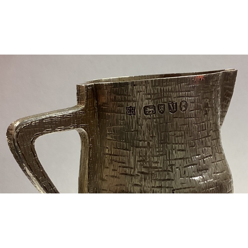 151 - A rare silver blackjack cream jug. London 1887. By EG. Approx. 136 grams. Est. £600 - £800.