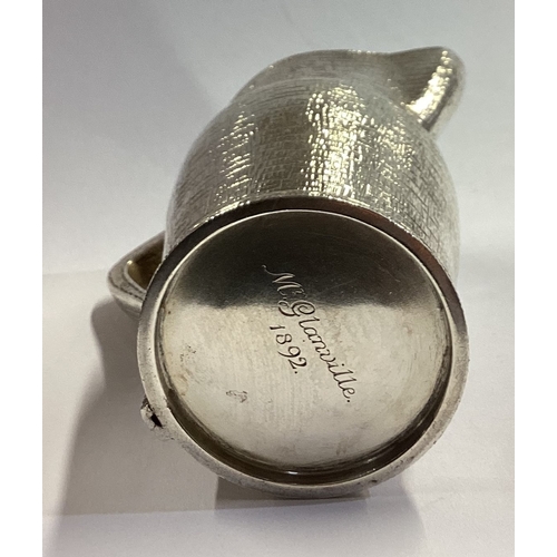 151 - A rare silver blackjack cream jug. London 1887. By EG. Approx. 136 grams. Est. £600 - £800.