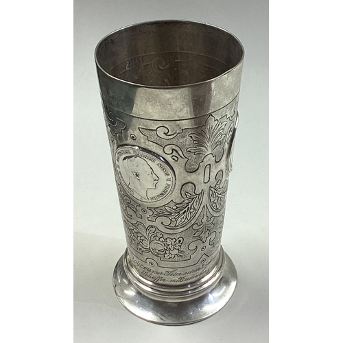 152 - A fine 19th Century Continental silver beaker with coin inset. Approx. 200 grams. Est. £250 - £300.