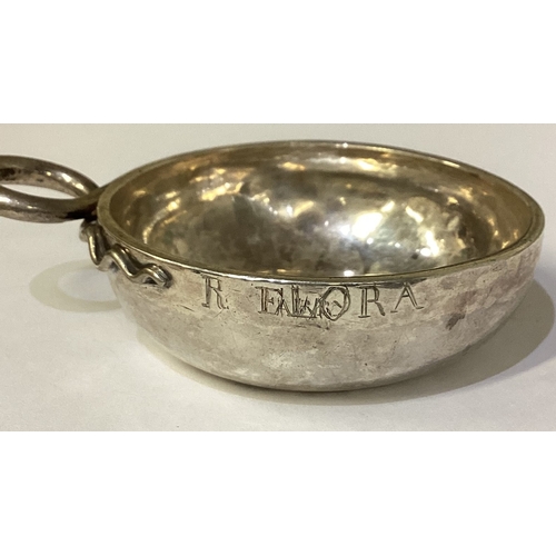 156 - An early 18th Century French silver wine taster. Marked to base. Approx. 80 grams. Est. £200 - £300.