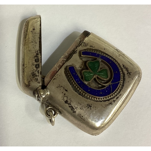 158 - A rare silver and enamelled vesta case with horseshoe and clover decoration. Birmingham 1919. By WHS... 