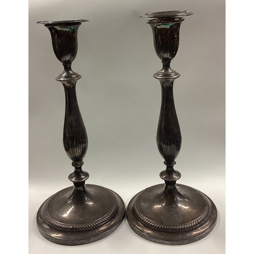 177 - A large and rare pair of 18th Century George III silver candlesticks with sconces part marked with d... 