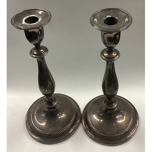 177 - A large and rare pair of 18th Century George III silver candlesticks with sconces part marked with d... 