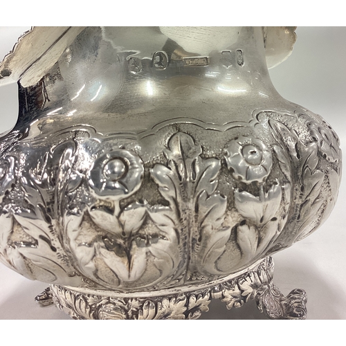 183 - A good Georgian silver cream jug with floral decoration. London. By DC. Approx. 281 grams. Est. £80 ... 