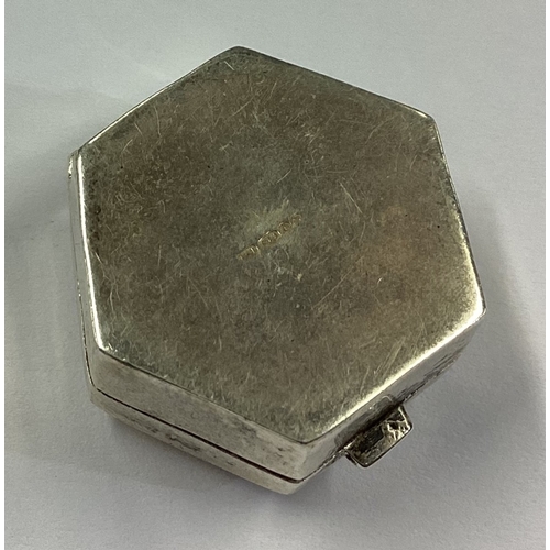 191 - An octagonal engraved silver pill box bearing import marks. Approx. 4 grams. Est. £10 - £20.