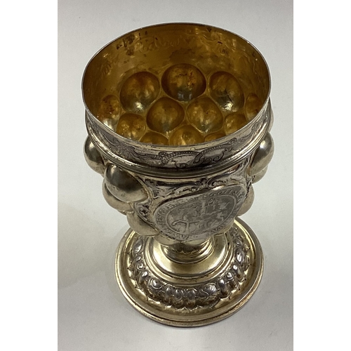 201 - An Antique German silver kiddush cup with ball decoration. Approx. 129 grams. Est. £300 - £400.