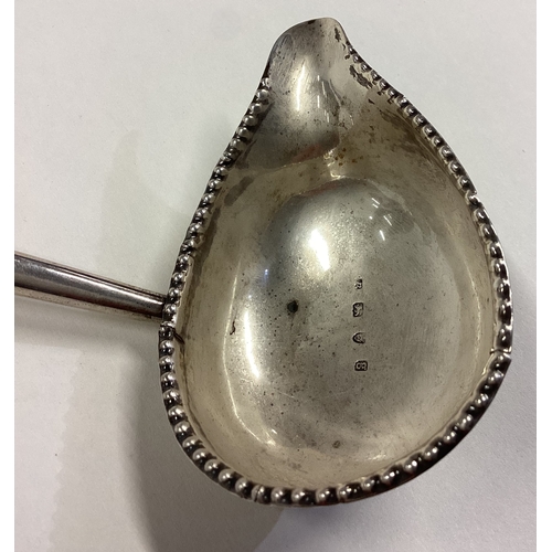 208 - An 18th Century Georgian silver toddy ladle. London 1782. Approx. 40 grams. Est. £100 - £150.