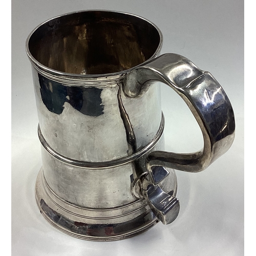 213 - NEWCASTLE: A large and oversized 18th Century silver tankard. Marked to base. Approx. 492 grams. Est... 