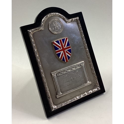 214 - A silver and enamelled presentation frame. Approx. 189 grams. Est. £50 - £80.