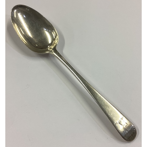 22 - An 18th Century silver bottom marked spoon with crested decoration. Approx. 42 grams. Est. £40 - £60... 