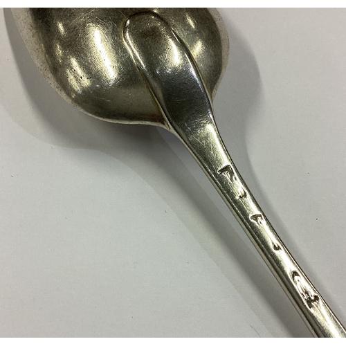 22 - An 18th Century silver bottom marked spoon with crested decoration. Approx. 42 grams. Est. £40 - £60... 