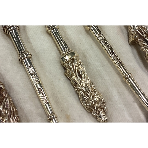 220 - A good cased set of twelve silver gilt Apostle top spoons. Sheffield. Retailed By Harrods. Approx. 2... 