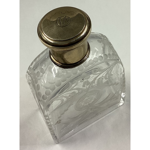 227 - A fine etched French silver and glass scent bottle with screw-top lid. Circa 1900. Est. £50 - £80.