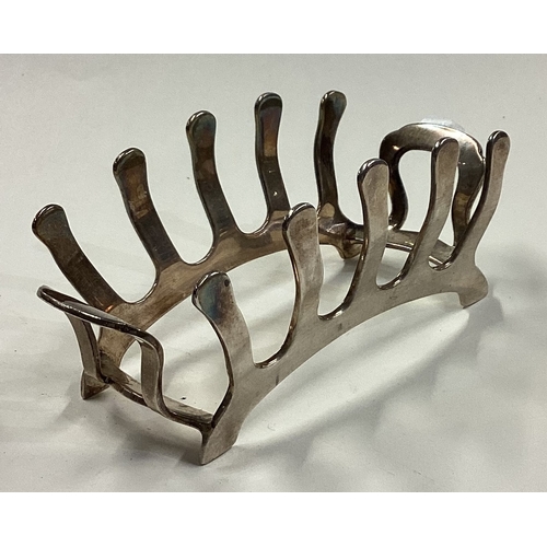 231 - A rare early 20th Century silver toast rack of unusual form. Birmingham. Approx. 73 grams. Est. £100... 