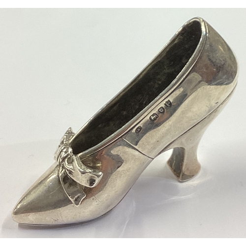 252 - A rare heavy Victorian silver model of a high heeled shoe with bow. London 1890. Approx. 79 grams. E... 