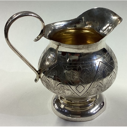 253 - A Russian silver jug with engraved decoration dated 1884. Fully marked to base and handle. Approx. 1... 