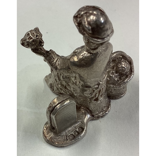 259 - RICHARD JARVIS: A cased silver figure of a flower seller. Approx. 35 grams. Est. £50 - £80.