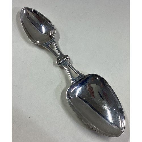 263 - An unusual silver travelling double medicine spoon with hinged mount. Approx. 47 grams. Est. £50 - £... 