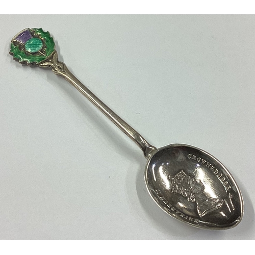 269 - A silver and enamelled spoon with thistle terminal. Birmingham 1959. By Toye, Kenning & Spencer. App... 