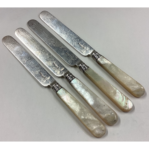 28 - A set of four silver and MOP dessert knives engraved with floral decoration. Sheffield 1868. Approx.... 