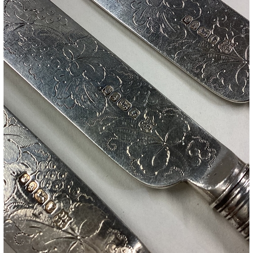 28 - A set of four silver and MOP dessert knives engraved with floral decoration. Sheffield 1868. Approx.... 