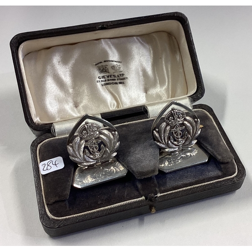 284 - A good pair of Naval silver menu holders on shaped bases. Birmingham. By Gieves Ltd. Approx. 57 gram... 