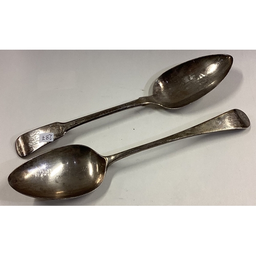 287 - EXETER: A Georgian silver table spoon together with one other. Approx. 129 grams. Est. £30 - £50.