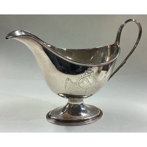 298 - HESTER BATEMAN: A rare large and oversized 18th Century silver sauceboat with crested decoration to ... 