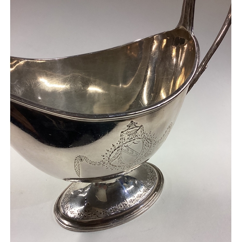 298 - HESTER BATEMAN: A rare large and oversized 18th Century silver sauceboat with crested decoration to ... 