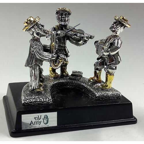 302 - A Judaica silver figure of three musicians. Est. £30 - £40.