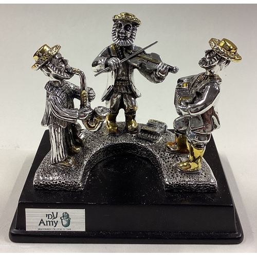 302 - A Judaica silver figure of three musicians. Est. £30 - £40.