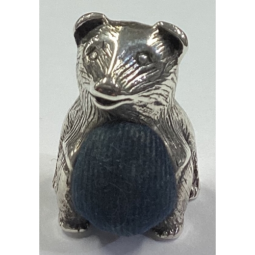 306 - A silver pin cushion in the form of a teddy bear. Approx. 14 grams. Est. £20 - £30.