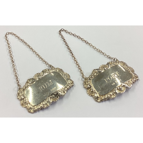 31 - A matched pair of silver wine labels for 'Port' and 'Rum'. Birmingham 1965/1966. Approx. 30 grams. E... 