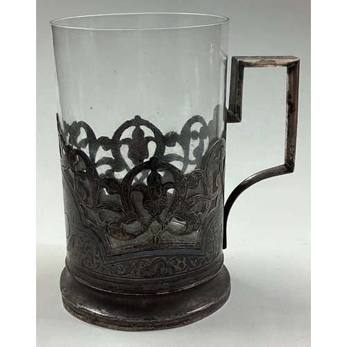 314 - A Russian silver, Niello and glass tea holder. Marked to base. Approx. 87 grams. Est. £100 - £150.